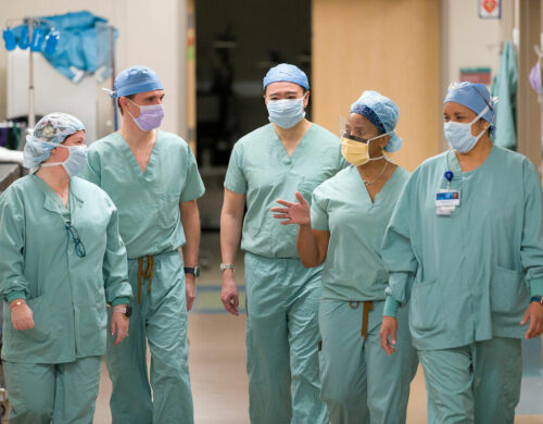 Medical Staff Walking Down Hallway