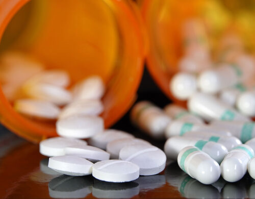 Bottles of pills tipped over