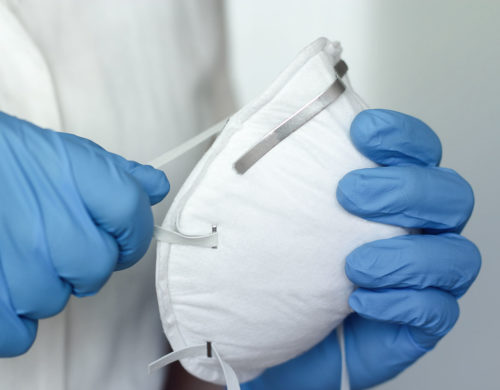 Holding N95 Mask