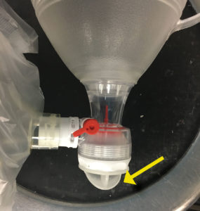 Figure 2: Ambu® Bag with Splash Guard. Yellow arrow indicates splash guard.