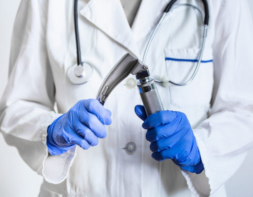 Anesthesiologist Holding a Laryngoscope