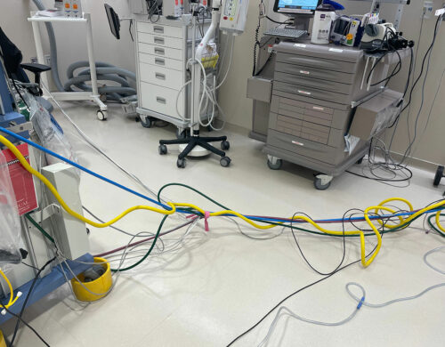 Figure 1. Gas lines, data cable, power cord, suction tubing from anesthesia machine causing trip hazard.