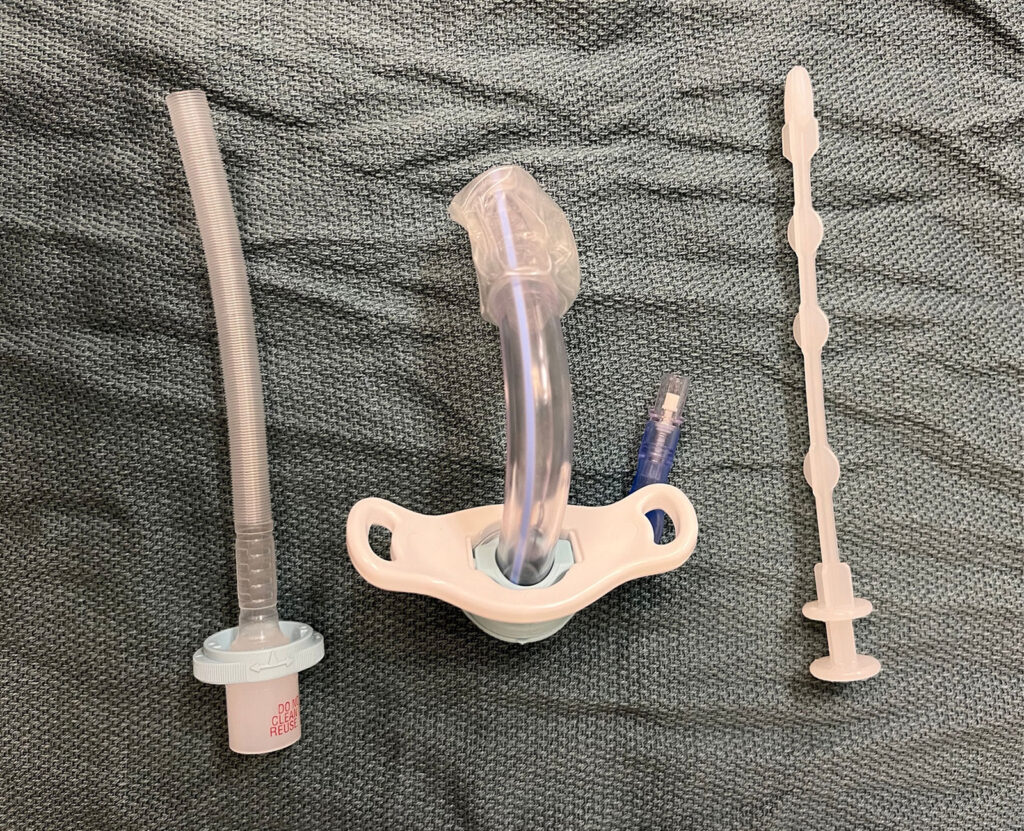 Figure 1: Middle—cuffed tracheostomy, left—obturator to assist with insertion of tracheostomy, right—removable inner cannula.