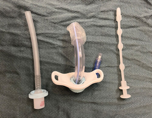 Middle—cuffed tracheostomy, left—obturator to assist with insertion of tracheostomy, right—removable inner cannula.