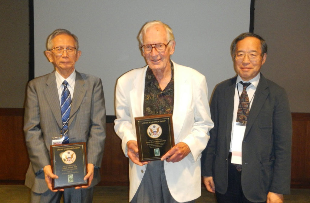 3rd IAMPOV Symposium, 2012, at the award ceremony<br /> From left:<br /> Dr. Takuo Aoyagi, Professor John Severinghaus, Dr. Katsuyuki Miyasaka (the author)