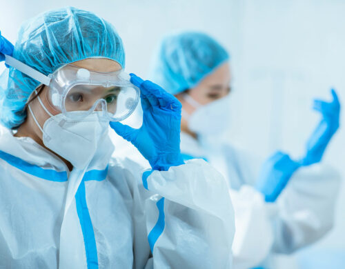 Nurses Putting on PPE