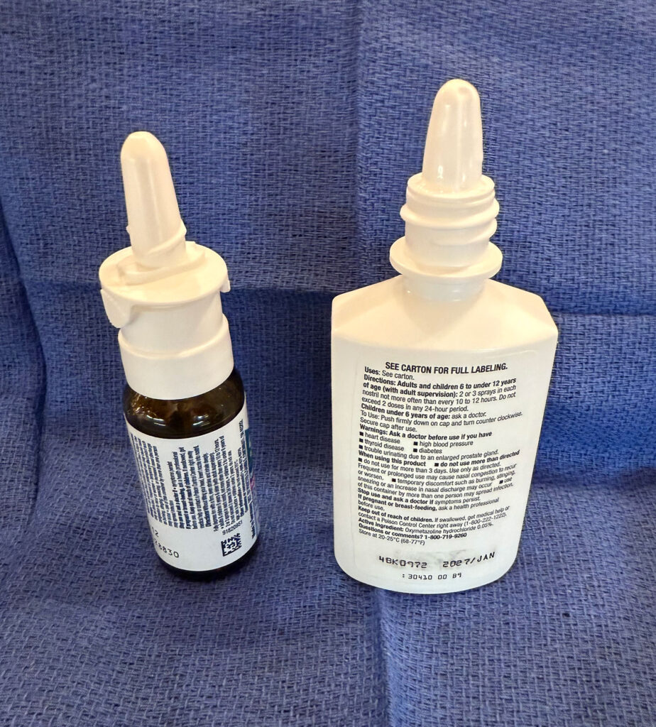 Figure 1: Oxymetazoline spray bottles with integrated pump delivery and manual mist systems.