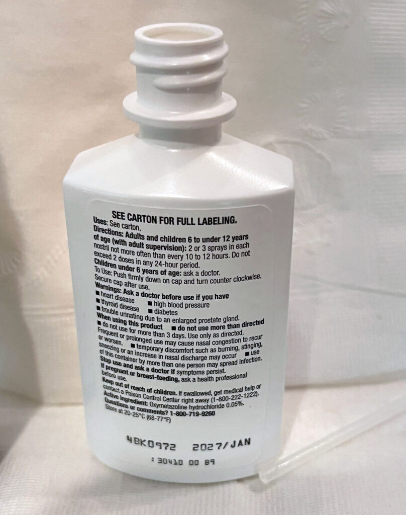 Figure 3: Spray bottle with top removed allowing access for withdrawal of mediation.